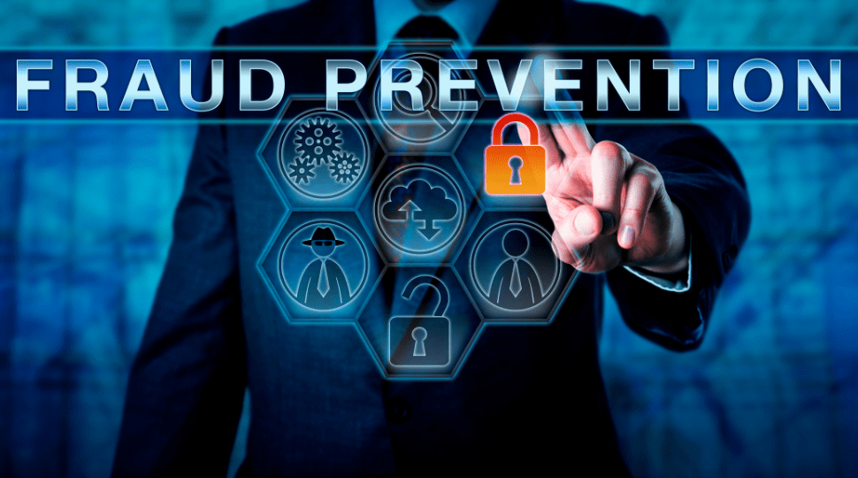 Fraud prevention image showing man clicking on lock symbol to signify utility fraud.